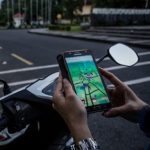 playing pokemon go on scooter