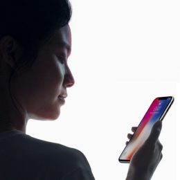 woman using face id with closed eyes