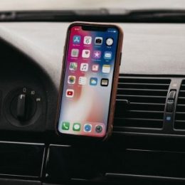 iPhone X connected to car via Bluetooth.